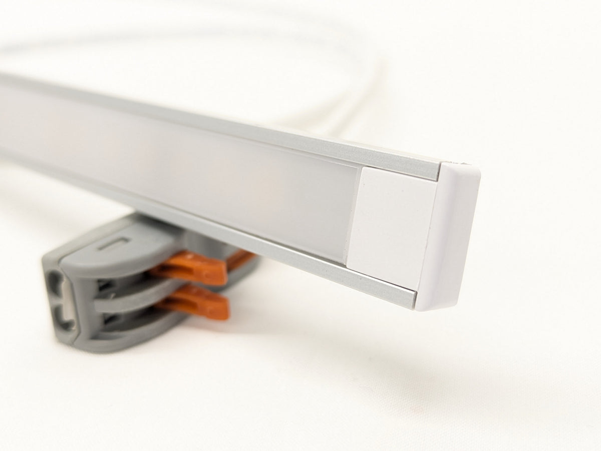 Slim LED strip lighting a kitchen worktop brightly from beneath a wall unit