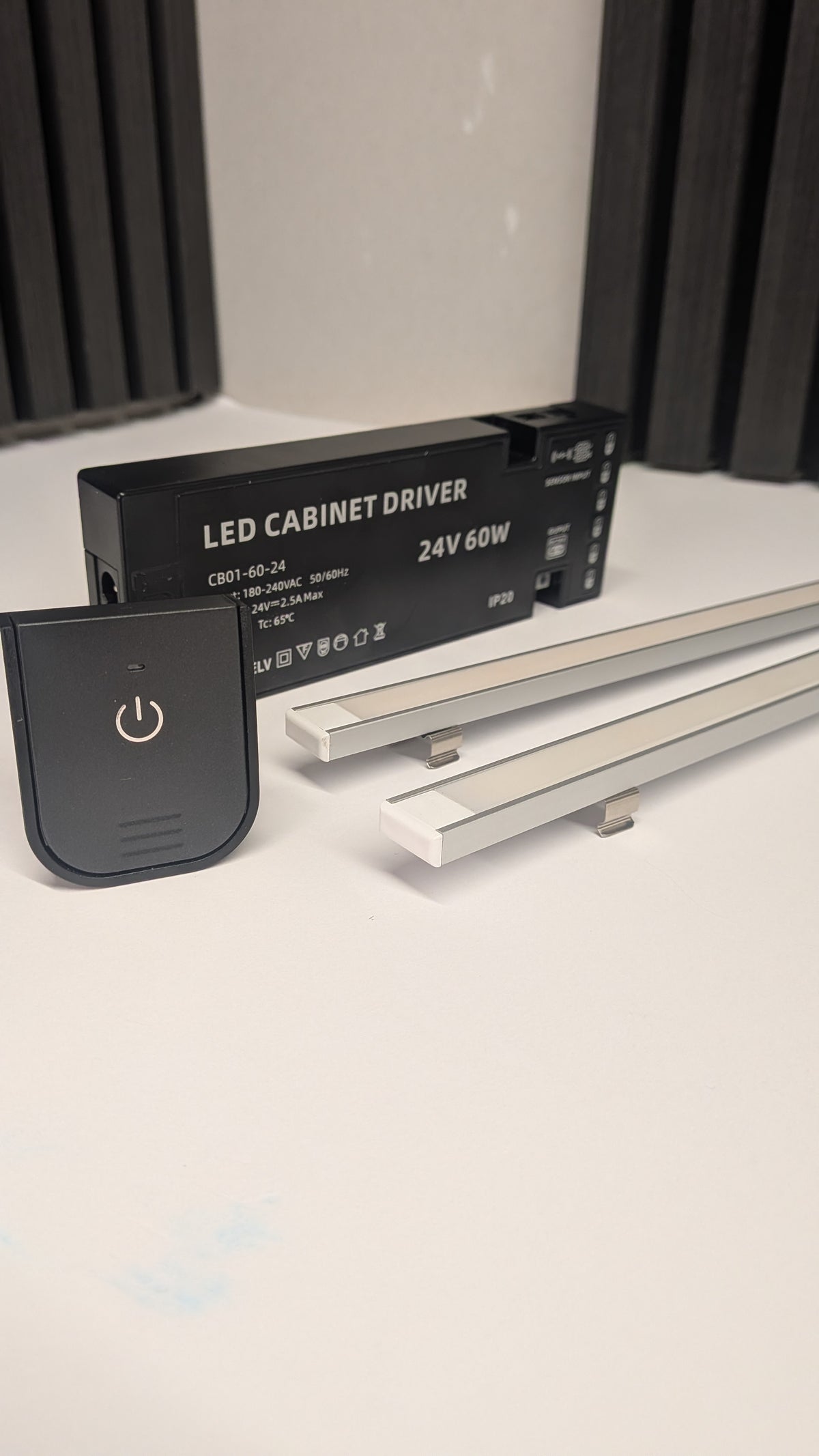 Soft dimmed glow from a dotless under cabinet LED strip over a kitchen counter