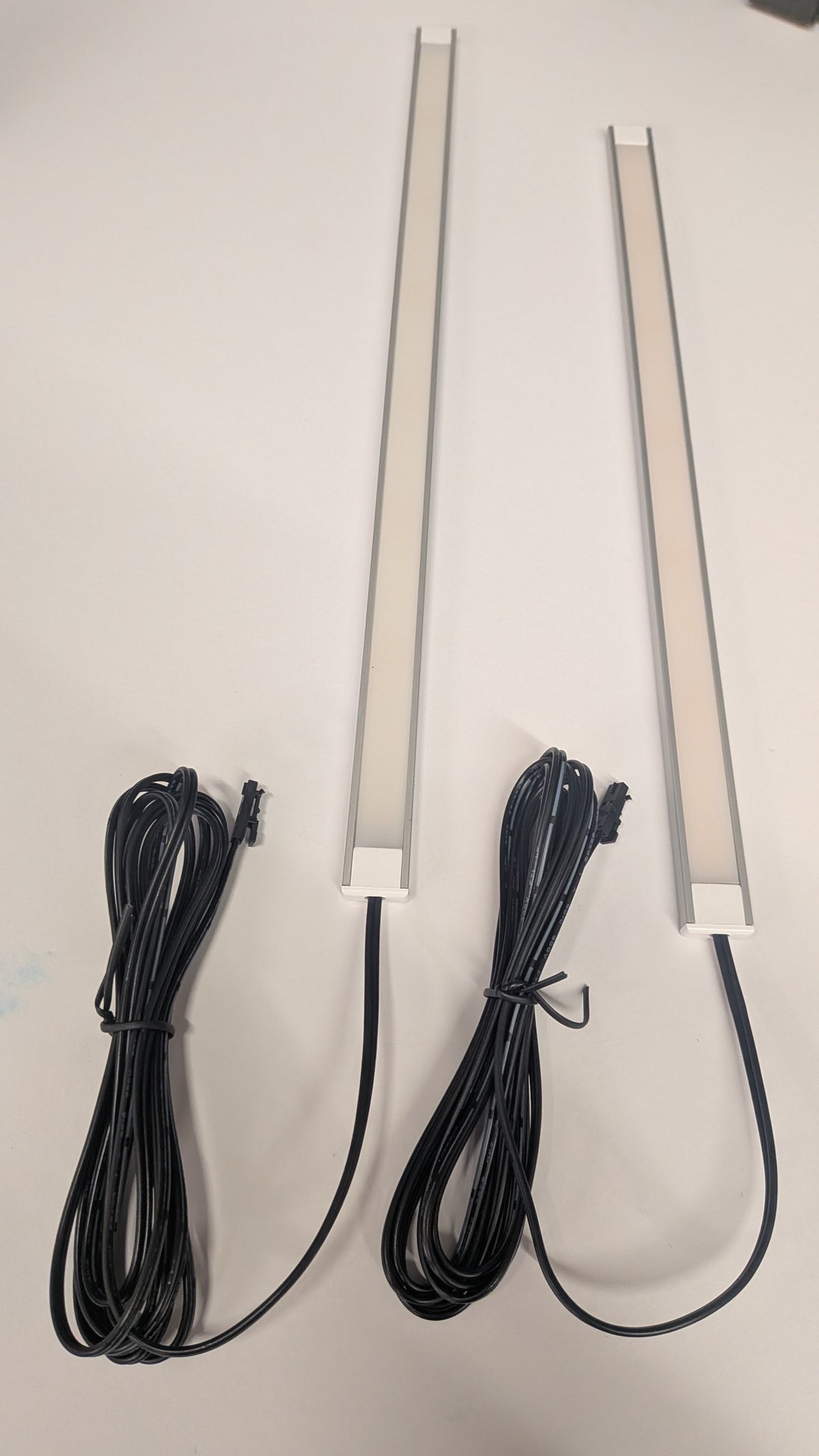 Super slim 7mm x 16mm LED strip fitted under a kitchen wall cabinet, seamless light