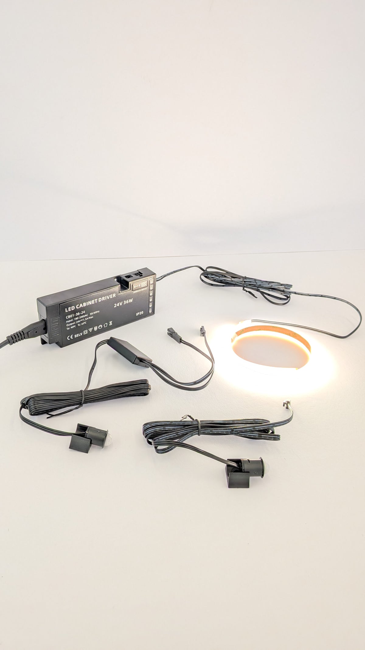 Plug in dotless LED strip fitted inside a wardrobe, lighting hanging clothes evenly