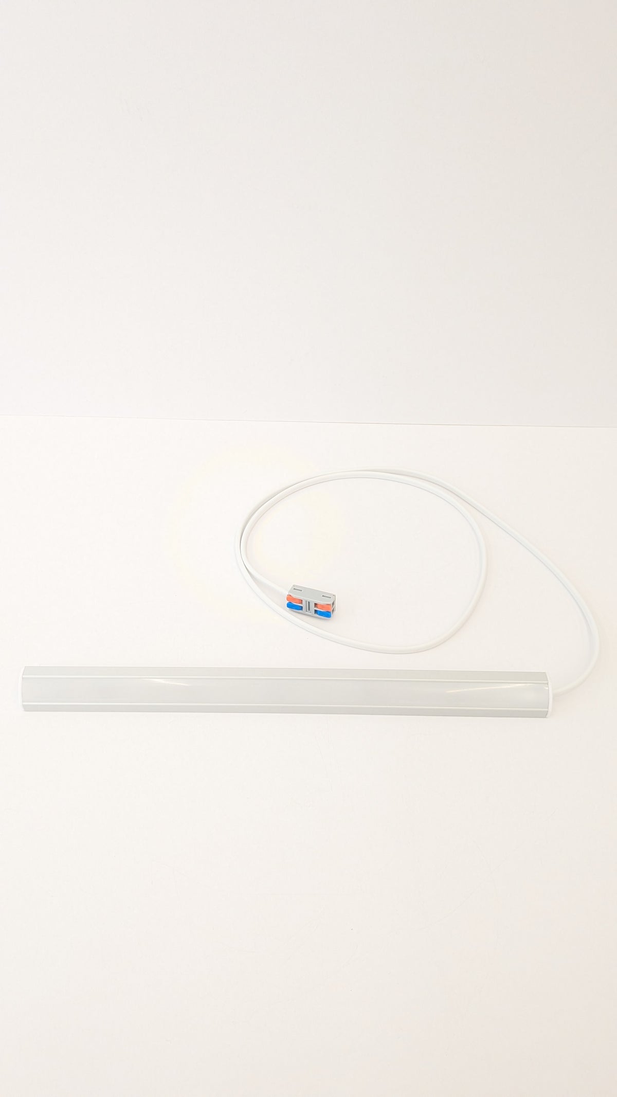 Slim 19mm corner LED light fitted under a kitchen cabinet, available in daylight and warm white with high CRI