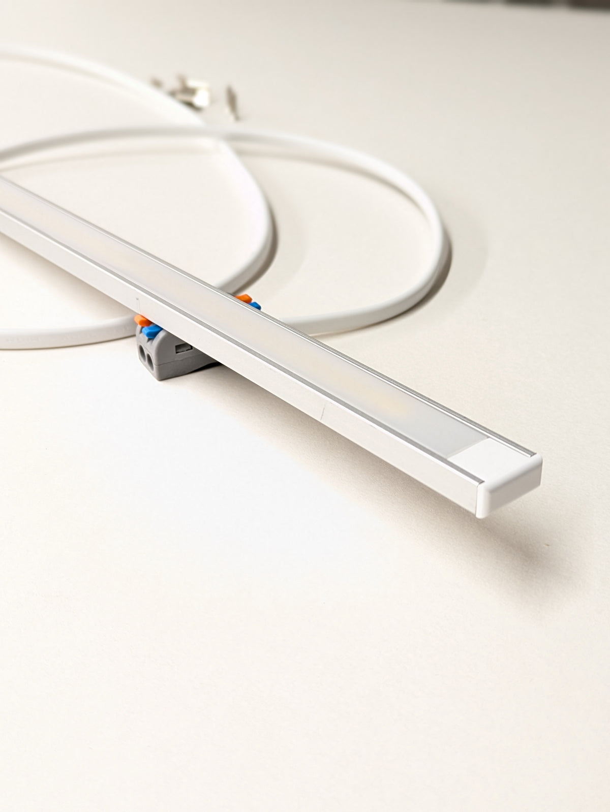 Dotless 7mm x 16mm LED strip fitted under a kitchen wall cabinet, soft continuous light