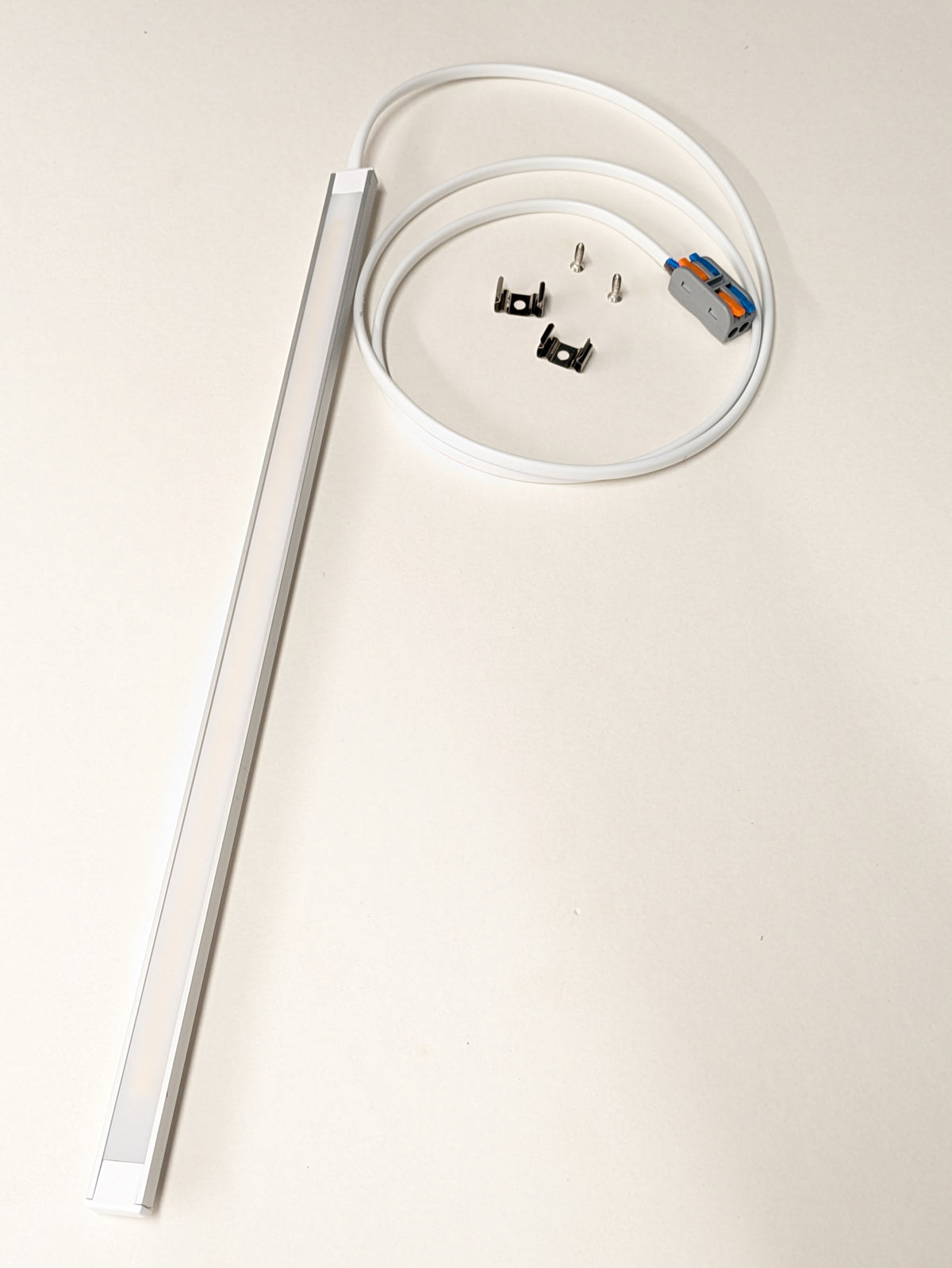 Slim dotless LED light lighting a kitchen worktop evenly from beneath a wall unit